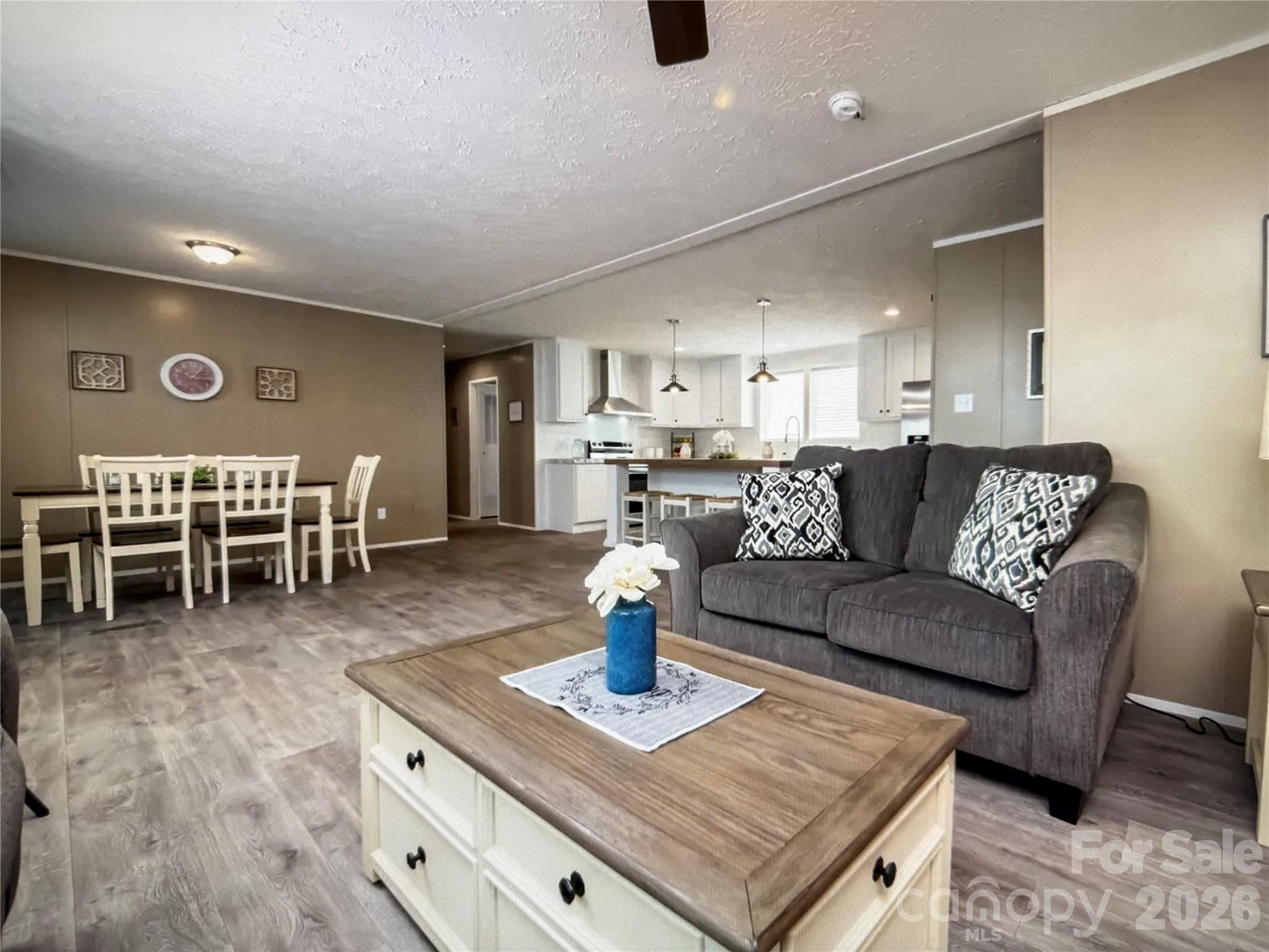 Tbd Kelly Hunter Road Marshall, NC 28753 - Photo 8 of 26 a living room with furniture and a dining table with kitchen view