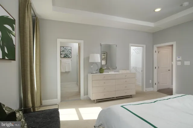 a room with a dresser and a mirror