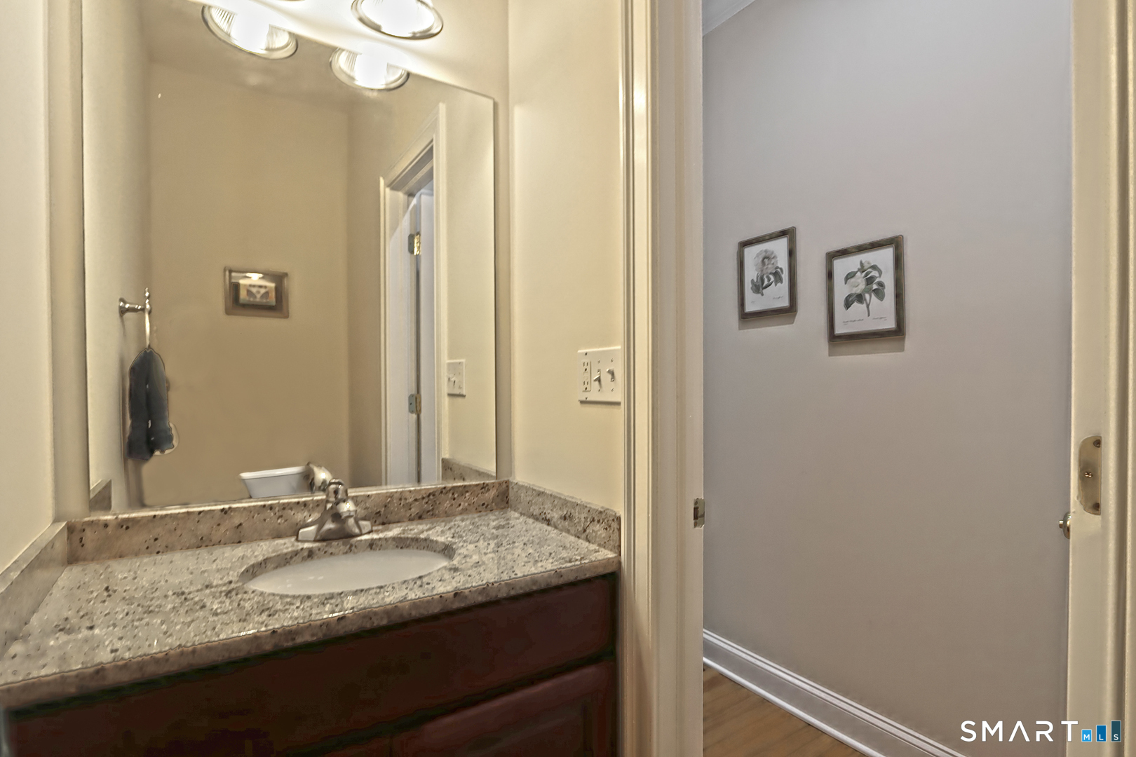102 Lantern Court, Unit 102 Clinton, CT 06413 - Photo 20 of 36 a bathroom with a granite countertop sink and a mirror