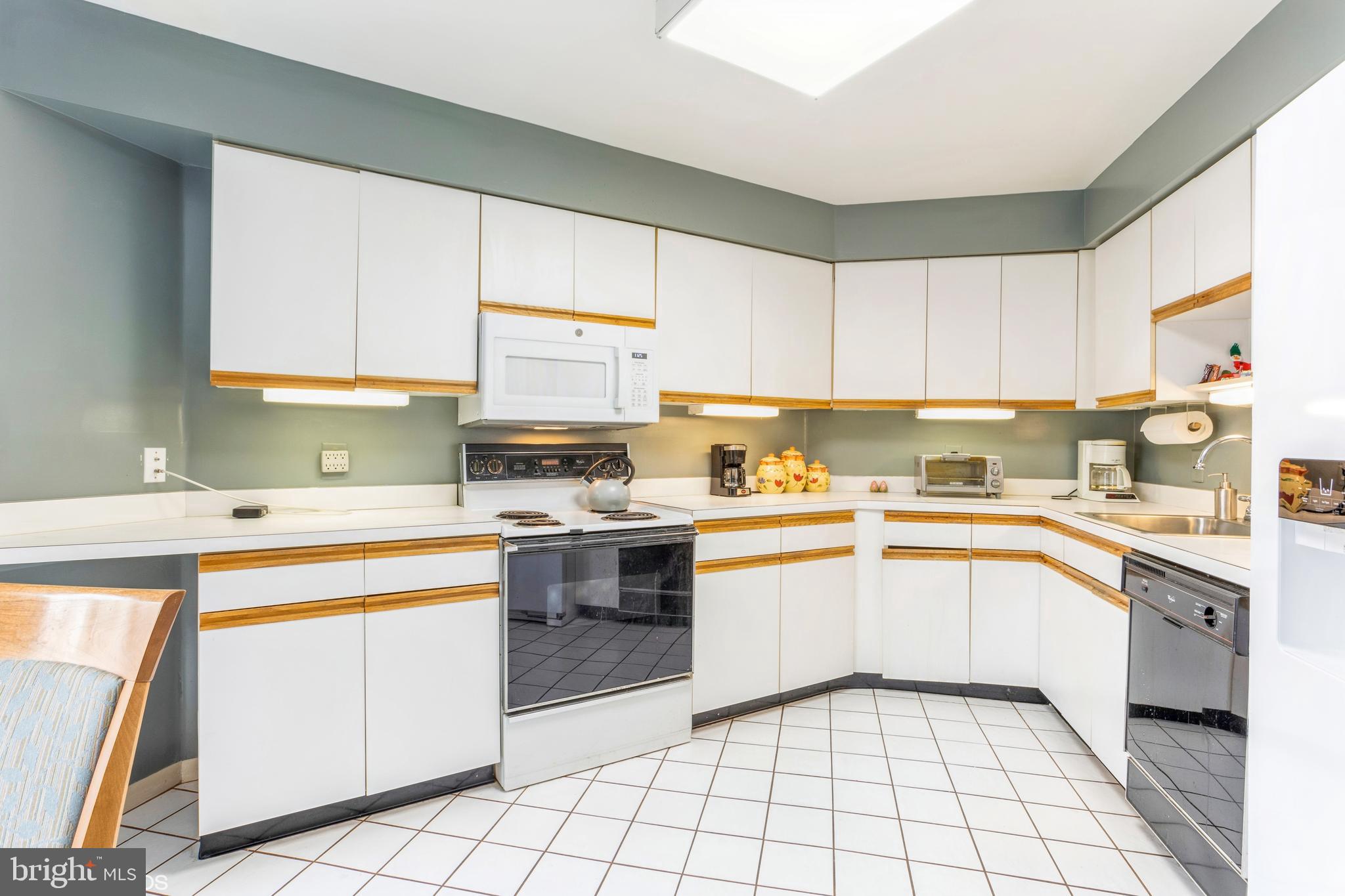 3041 Fallstaff Road, Unit 502D Baltimore, MD 21209 - Photo 20 of 45 a kitchen with cabinets appliances a sink and a counter