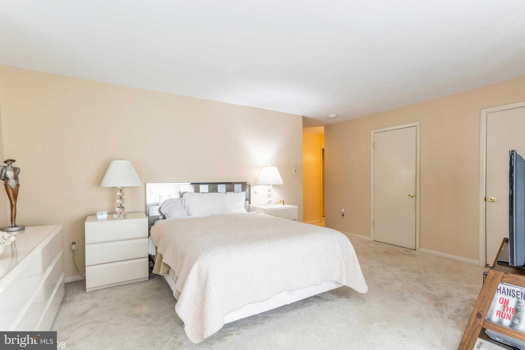 3041 Fallstaff Road, Unit 502D Baltimore, MD 21209 - Photo 34 of 45 a bedroom with a bed and a lamp