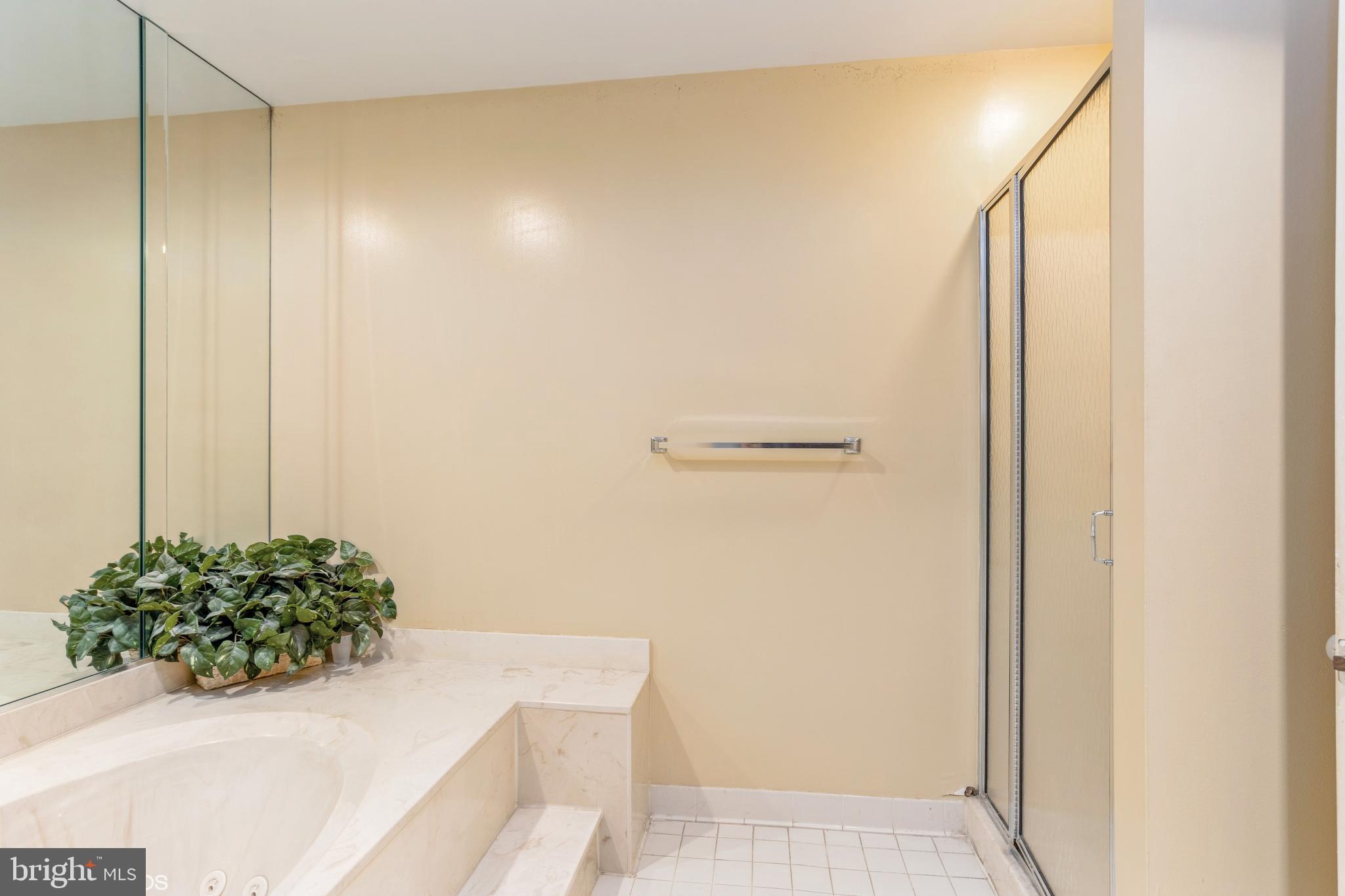 3041 Fallstaff Road, Unit 502D Baltimore, MD 21209 - Photo 42 of 45 a bathroom with a shower and a sink