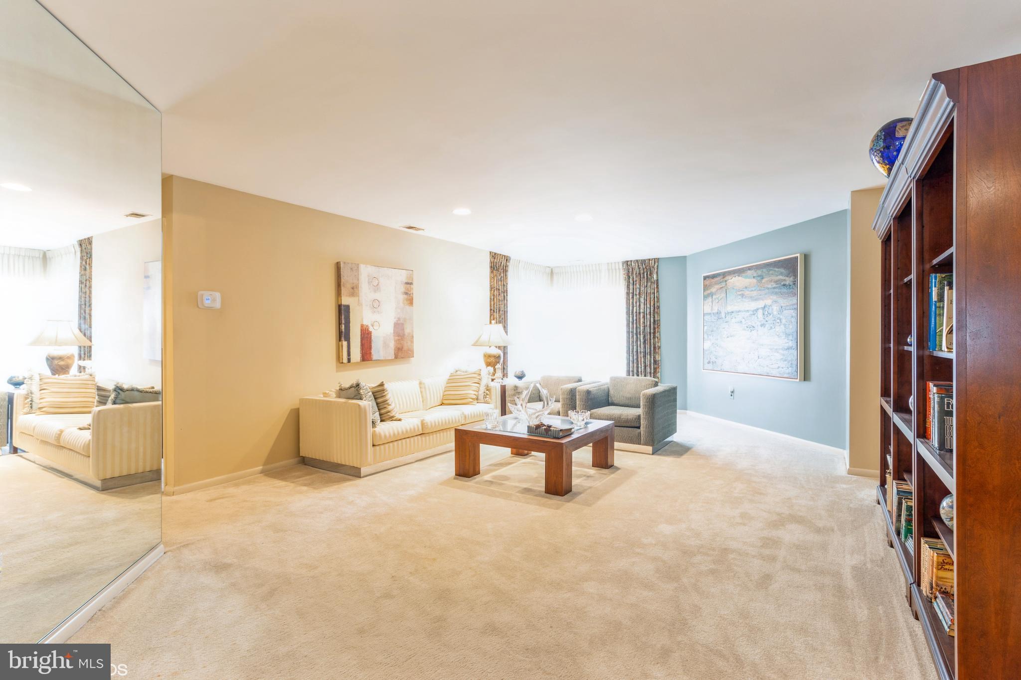 3041 Fallstaff Road, Unit 502D Baltimore, MD 21209 - Photo 6 of 45 a living room with furniture and a window