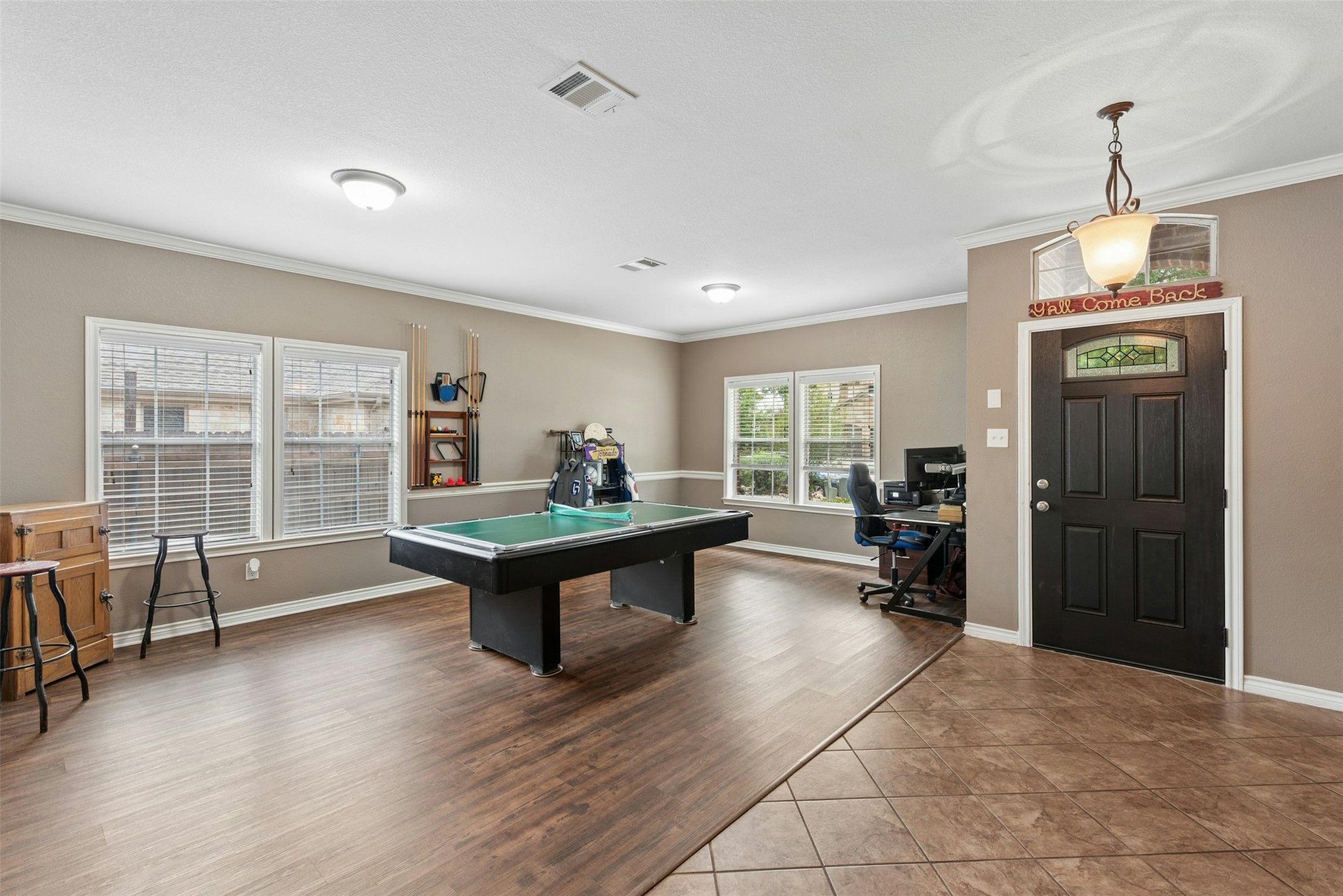 30013 Edgewood Drive Georgetown, TX 78628 - Photo 4 of 39 Combination Living Room/Formal Dining Room. Flexible space to suit your lifestyle. The room provides natural light, and a Foyer featuring a black entry door with a decorative glass insert