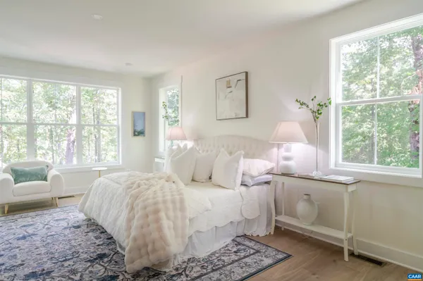 a bedroom with a bed and a fireplace