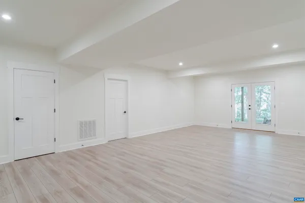 a view of empty room with windows