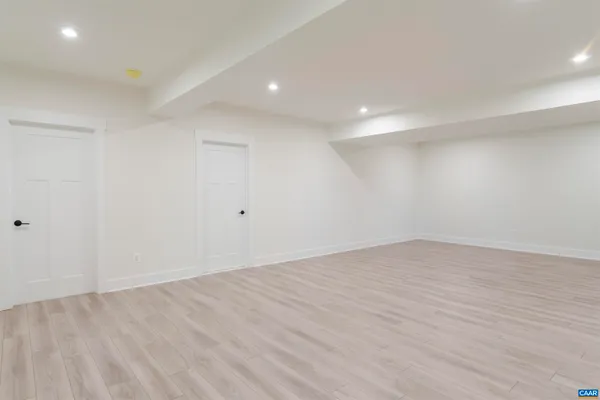 a view of a room with wooden walls