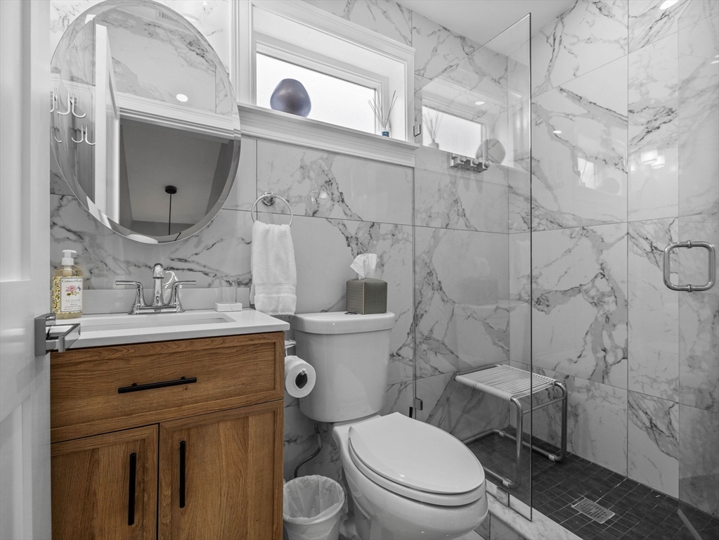 19 Cold Spring Road North Reading, MA 01864 - Photo 16 of 37 a bathroom with a granite countertop toilet sink and mirror