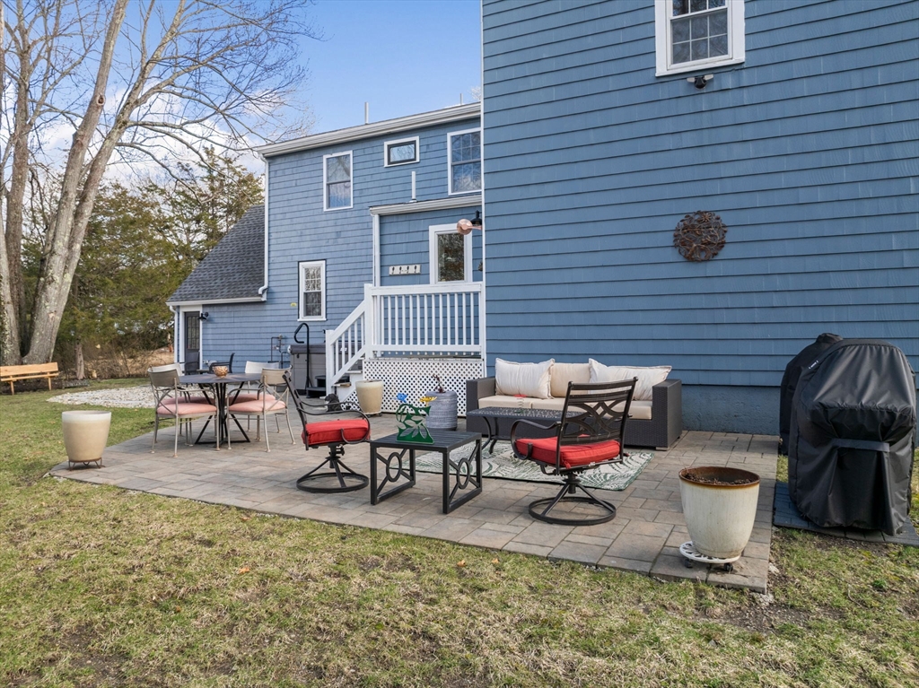 19 Cold Spring Road North Reading, MA 01864 - Photo 28 of 37 a backyard of a house with fire pit and couch