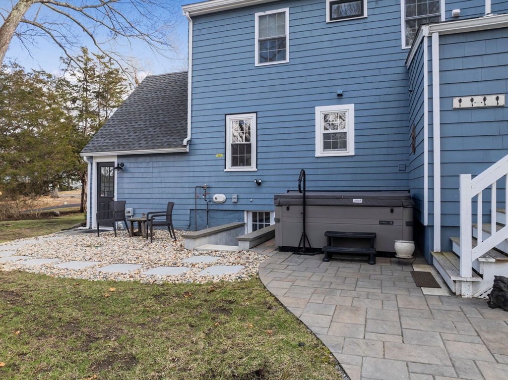 19 Cold Spring Road North Reading, MA 01864 - Photo 29 of 37 a backyard of a house with barbeque oven and outdoor seating