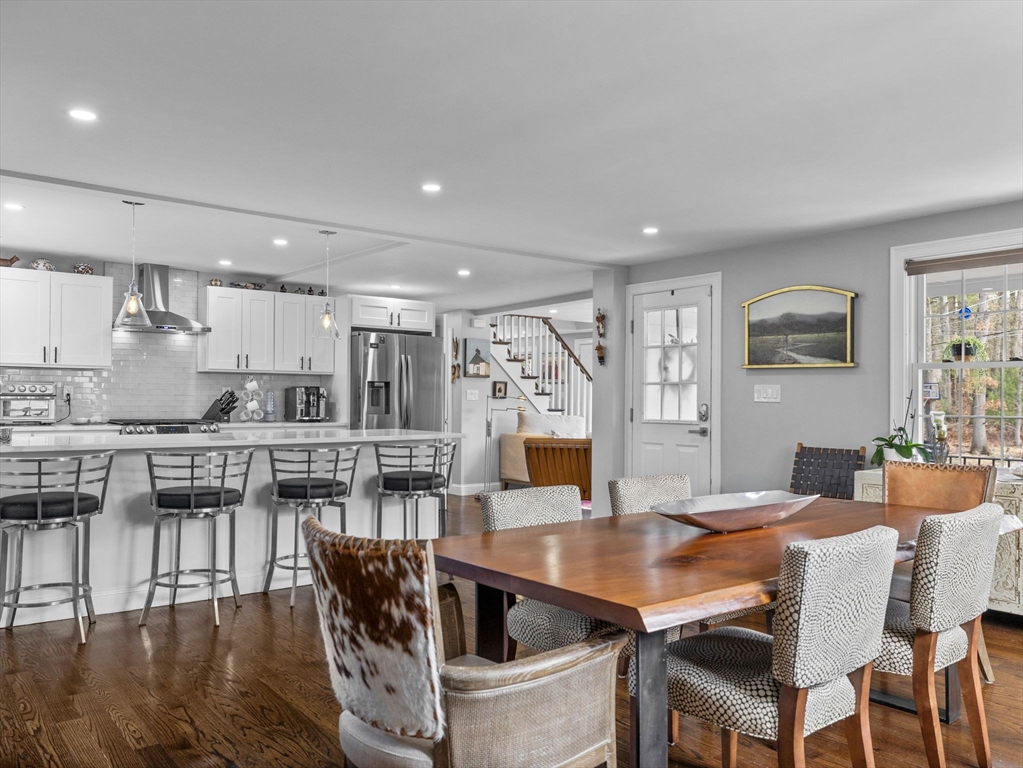 19 Cold Spring Road North Reading, MA 01864 - Photo 5 of 37 a kitchen with stainless steel appliances granite countertop a table chairs and a refrigerator