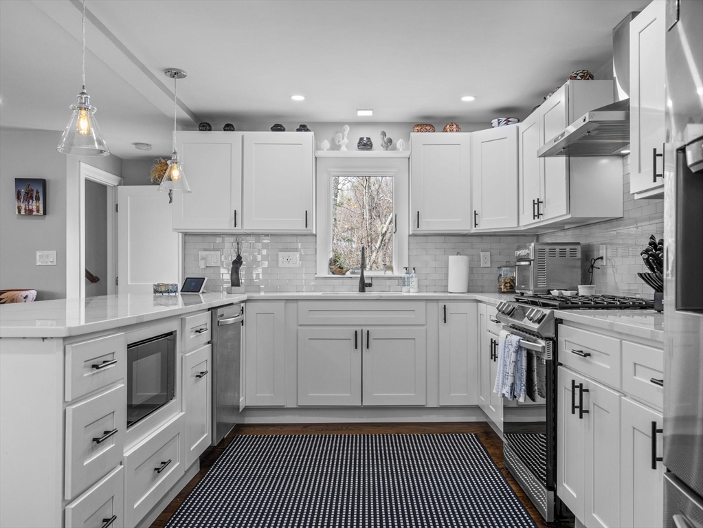 19 Cold Spring Road North Reading, MA 01864 - Photo 7 of 37 a kitchen with white cabinets appliances and a sink