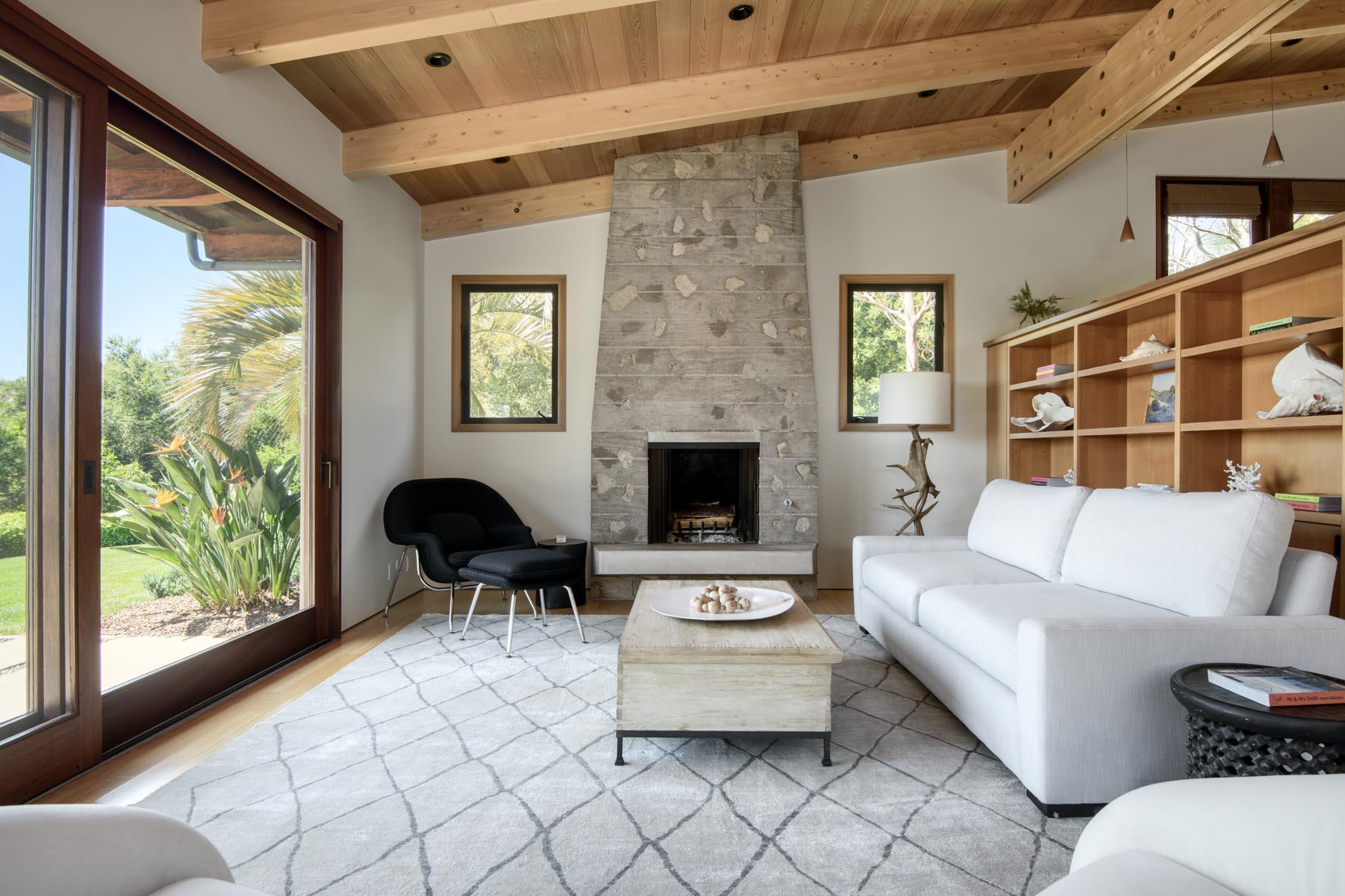 4038 Foothill Road Carpinteria, CA 93013 - Photo 13 of 36 a living room with furniture and a fireplace