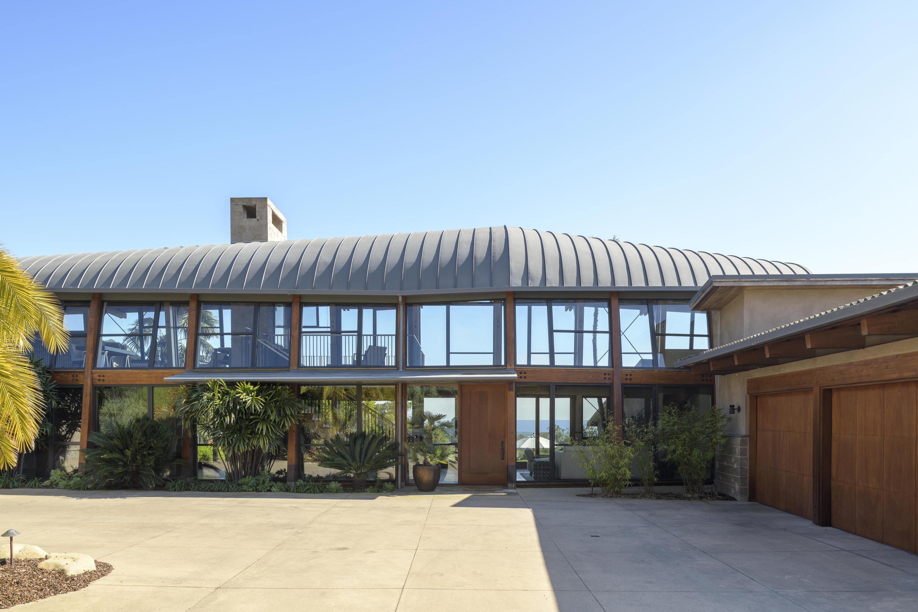 4038 Foothill Road Carpinteria, CA 93013 - Photo 2 of 36 a front view of a building with a garden
