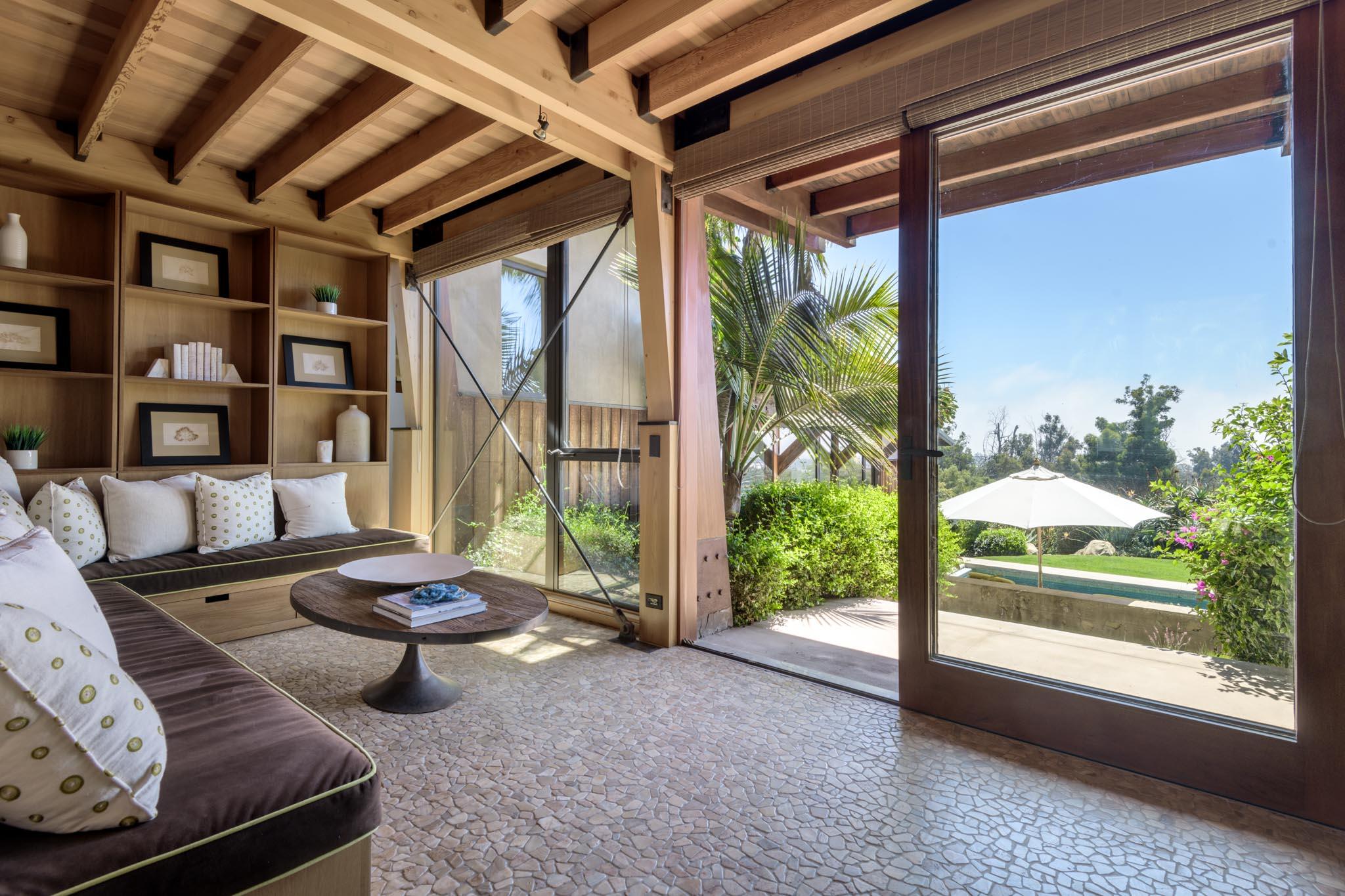 4038 Foothill Road Carpinteria, CA 93013 - Photo 22 of 36 a living room with furniture and a large window