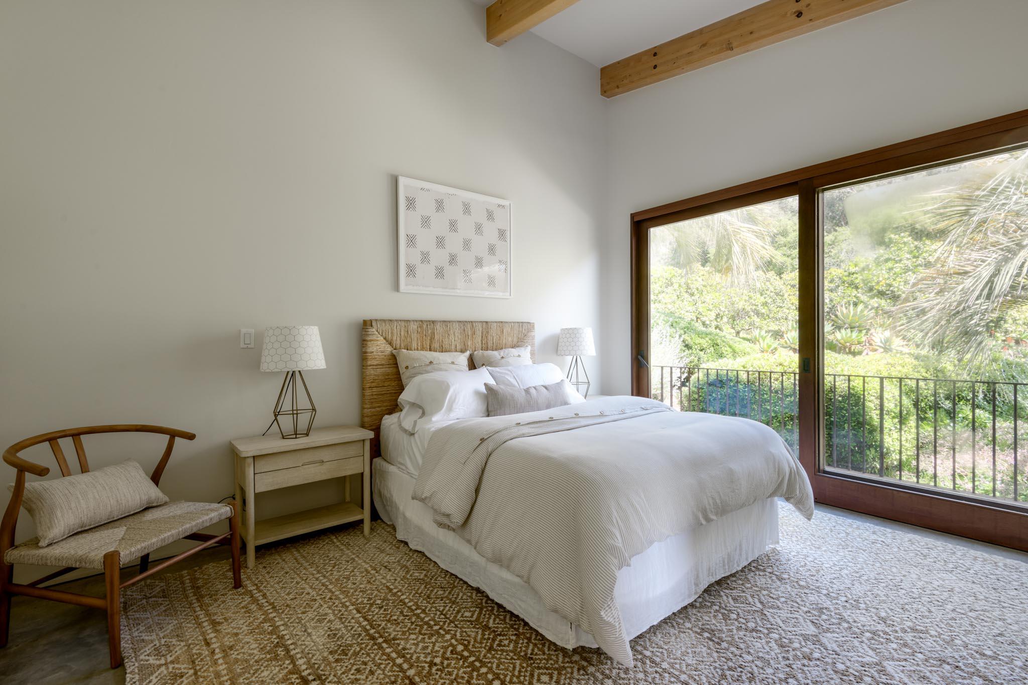 4038 Foothill Road Carpinteria, CA 93013 - Photo 24 of 36 a bedroom with a bed chair and window