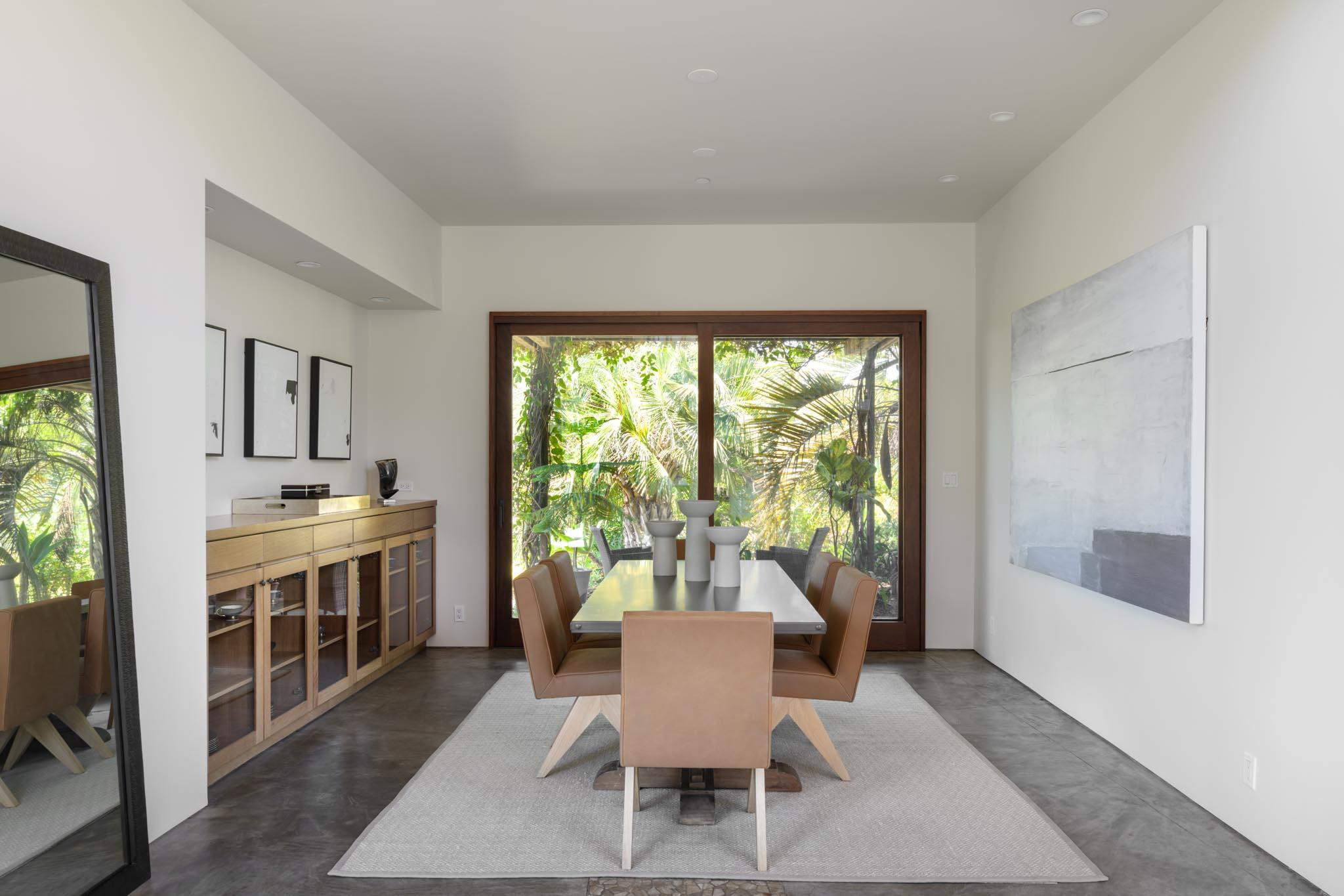 4038 Foothill Road Carpinteria, CA 93013 - Photo 8 of 36 a dining room with wooden floor and a sink