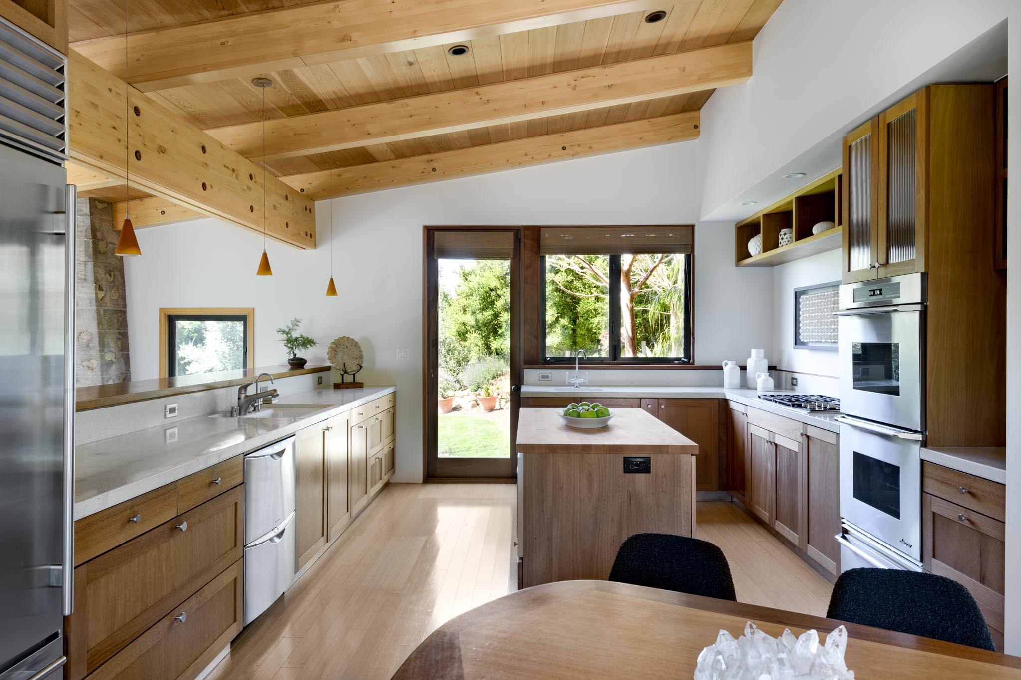 4038 Foothill Road Carpinteria, CA 93013 - Photo 10 of 36 a kitchen with stainless steel appliances a sink a stove a refrigerator cabinets and a window