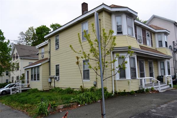 155 Adams Street Waltham, MA 02453 - Photo 2 of 5 a view of a house with a yard
