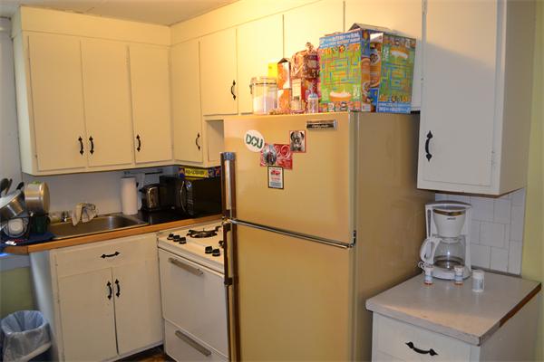 155 Adams Street Waltham, MA 02453 - Photo 3 of 5 a kitchen with refrigerator and cabinets