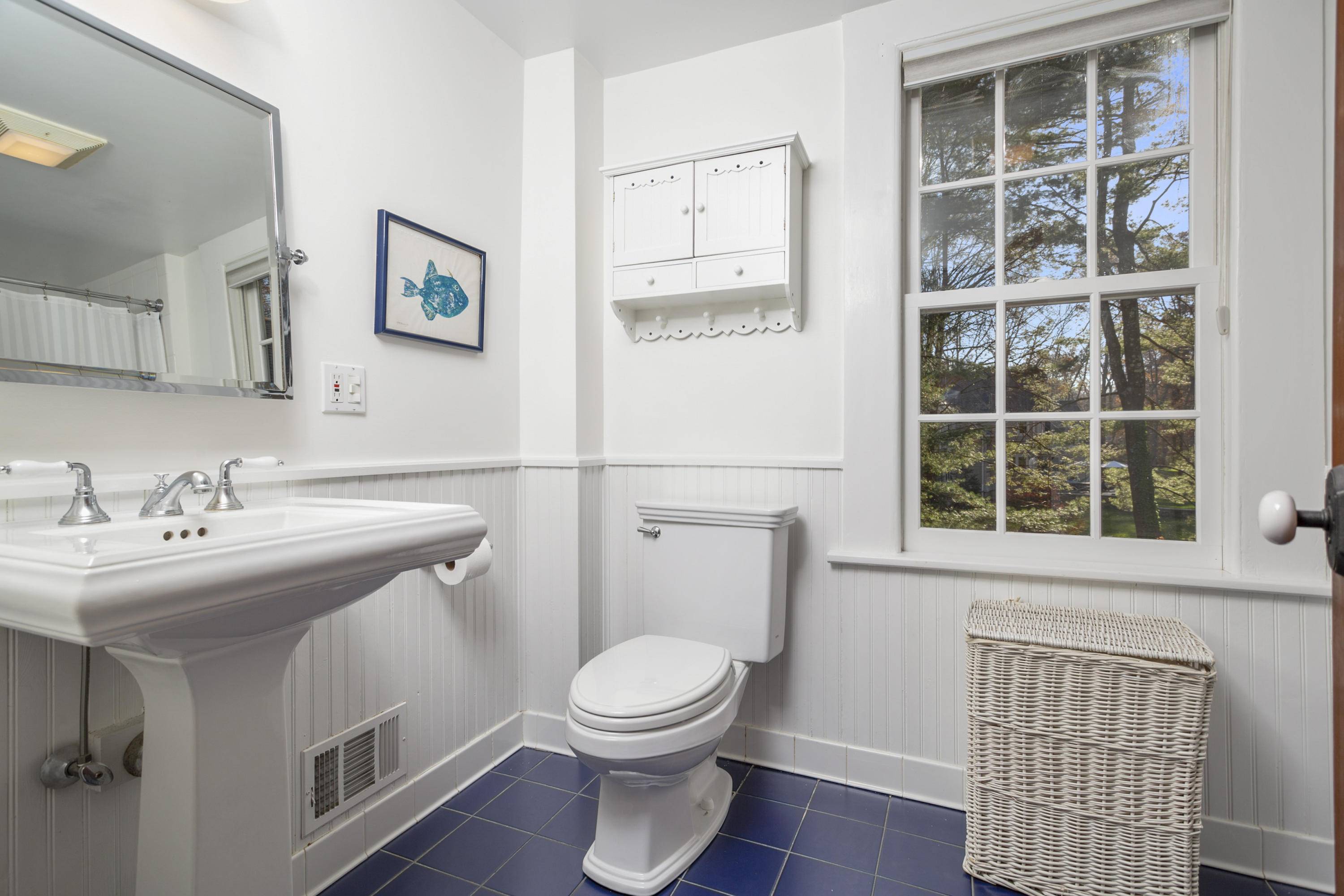 315 Middlesex Road Darien, CT 06820 - Photo 42 of 59 a bathroom with a toilet a sink and a window