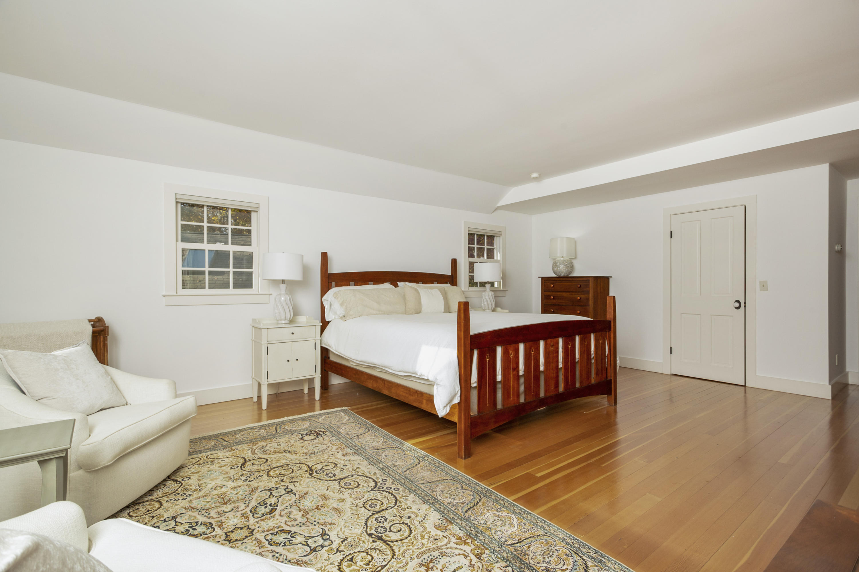 315 Middlesex Road Darien, CT 06820 - Photo 46 of 59 a bedroom with a bed and wooden floor
