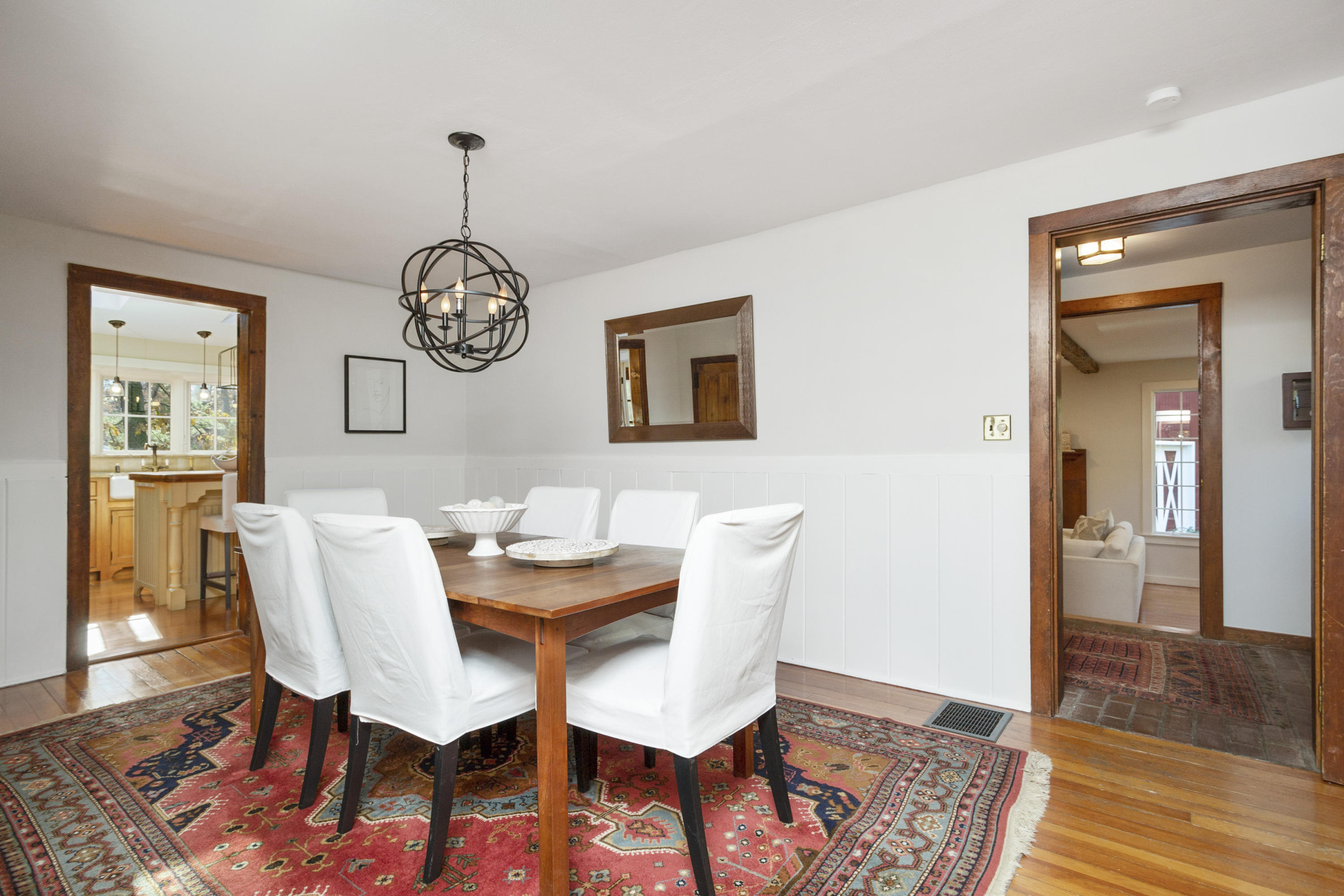 315 Middlesex Road Darien, CT 06820 - Photo 10 of 59 a view of a dining room with furniture wooden floor and a rug