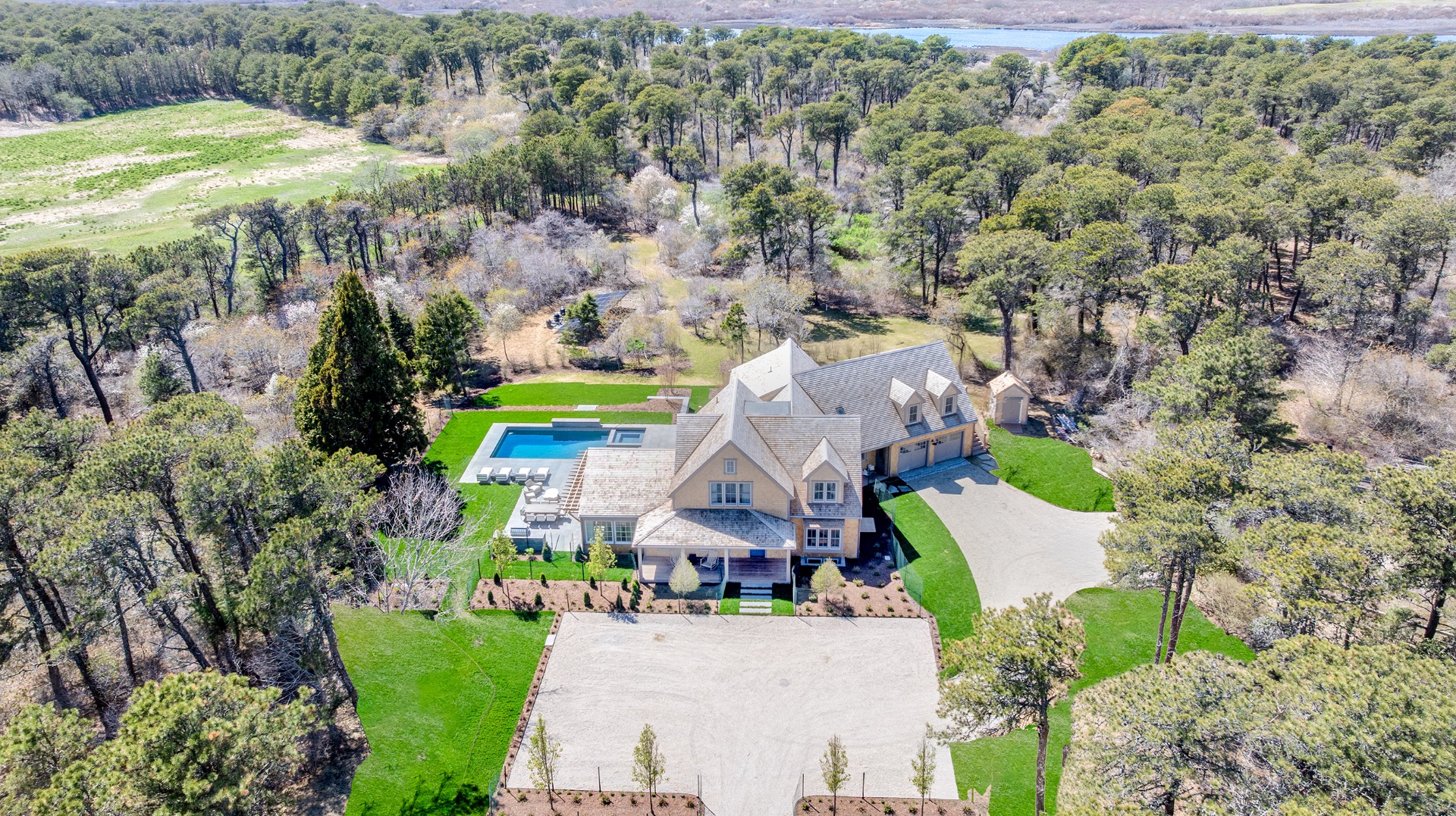 15 Deer Run Road Nantucket, MA 02554 - Photo 3 of 62 an aerial view of a house with a yard and lake view