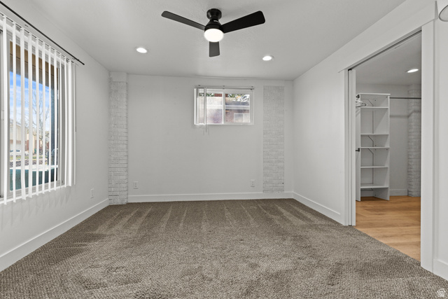 2101 West 3900th Street South Roy, UT 84067 - Photo 11 of 36 Carpeted room featuring a ceiling fan with integrated lighting, recessed lighting, and vertical window blinds
