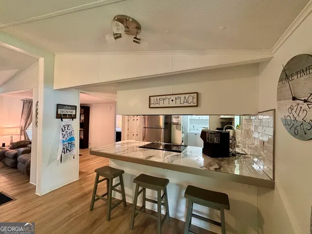 a dinning room with table and chairs