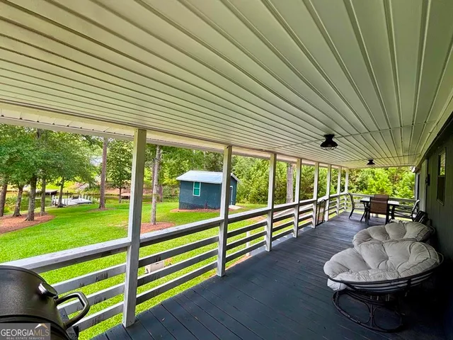 a living room with furniture and a swimming pool