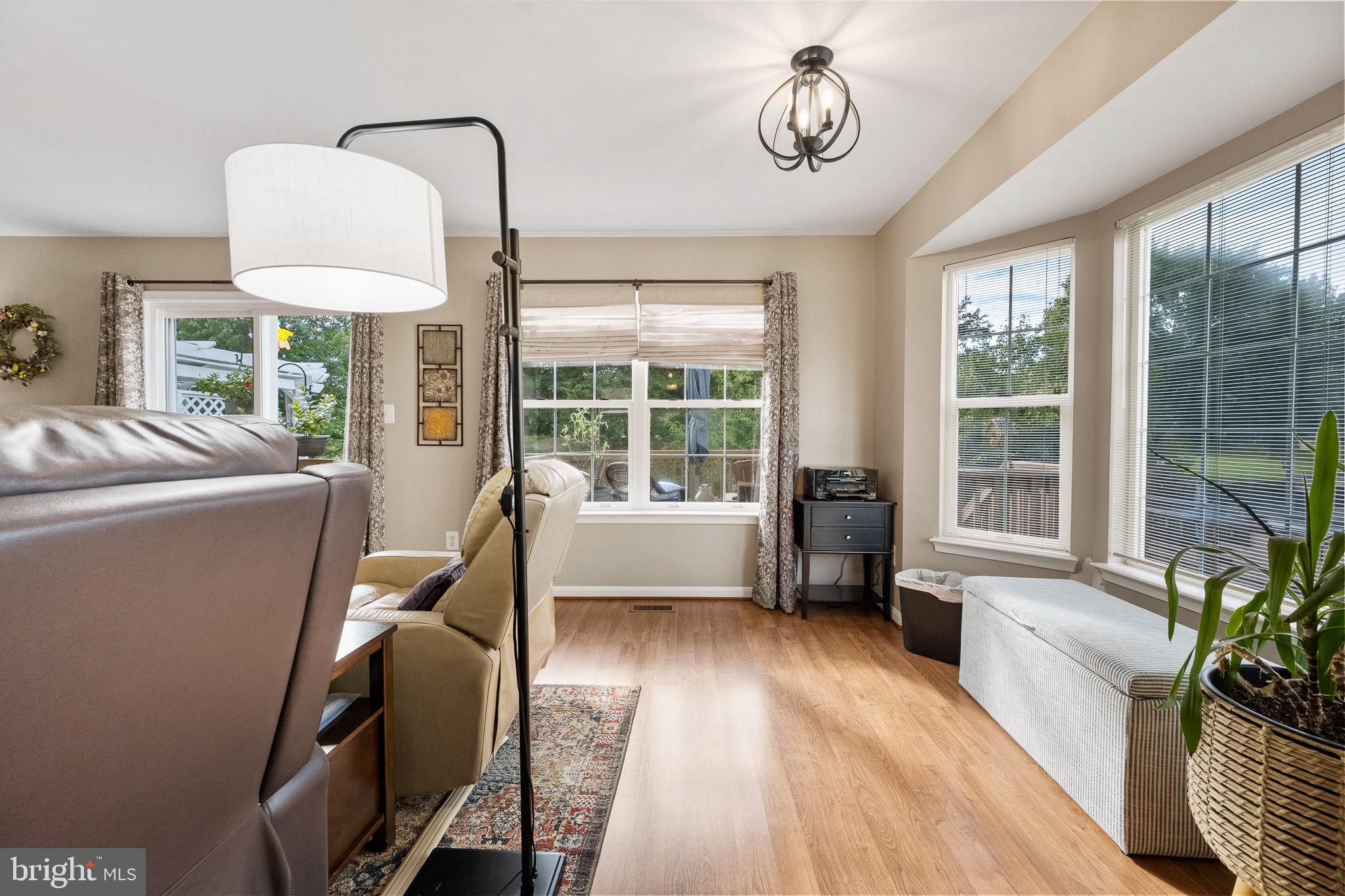 43111 Gatwick Square Ashburn, VA 20147 - Photo 12 of 34 a living room with furniture and a window