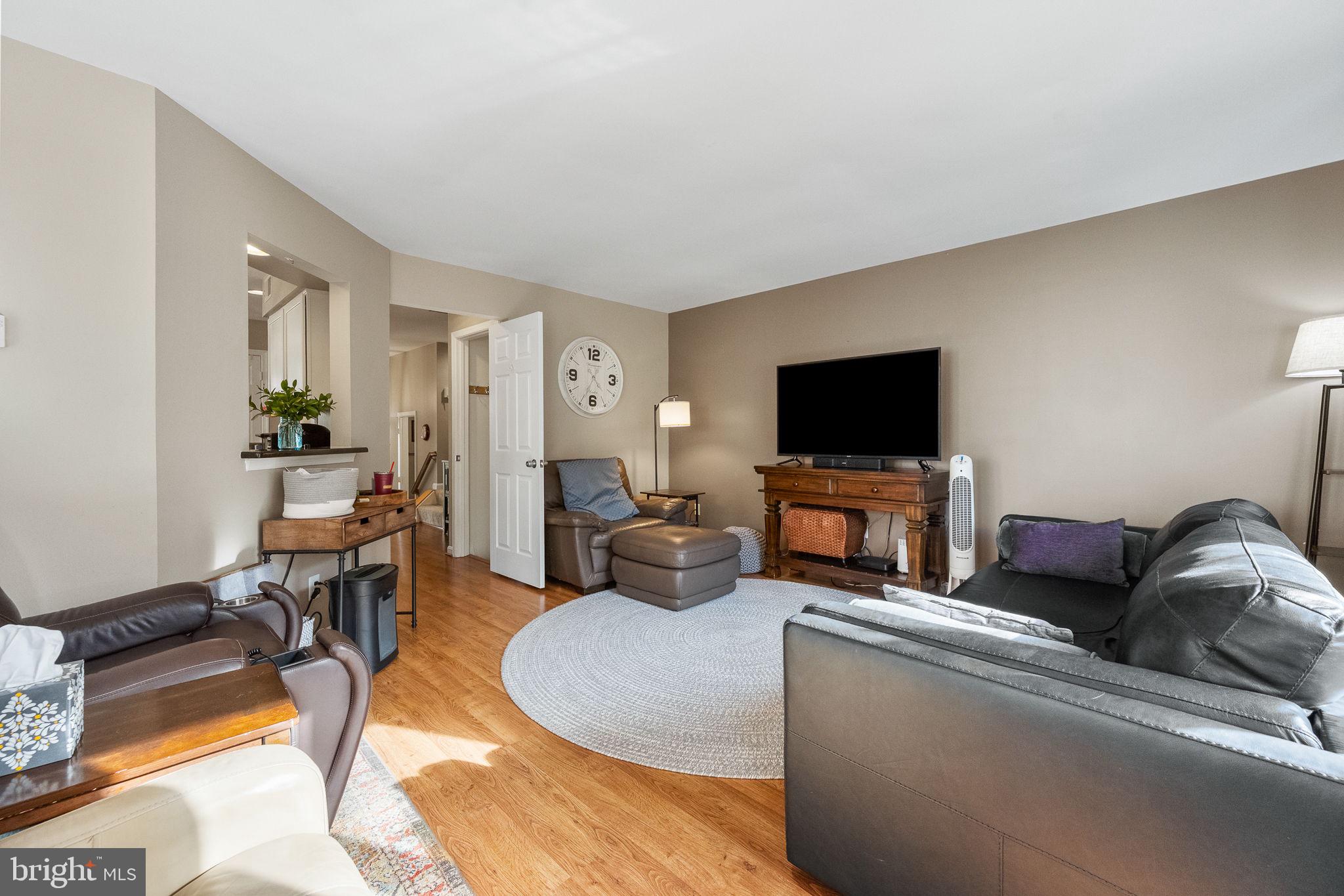 43111 Gatwick Square Ashburn, VA 20147 - Photo 13 of 34 a living room with furniture and a flat screen tv