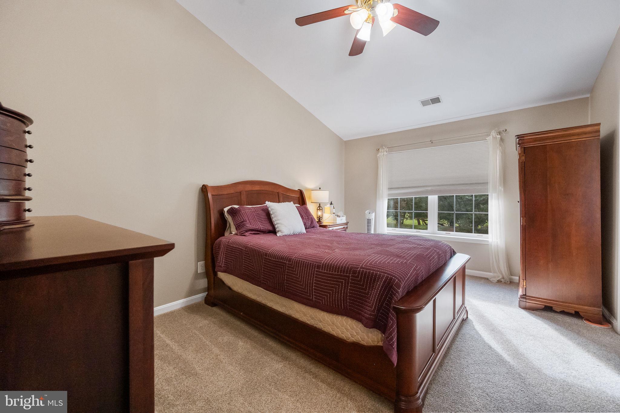 43111 Gatwick Square Ashburn, VA 20147 - Photo 15 of 34 a bedroom with a bed and a chandelier