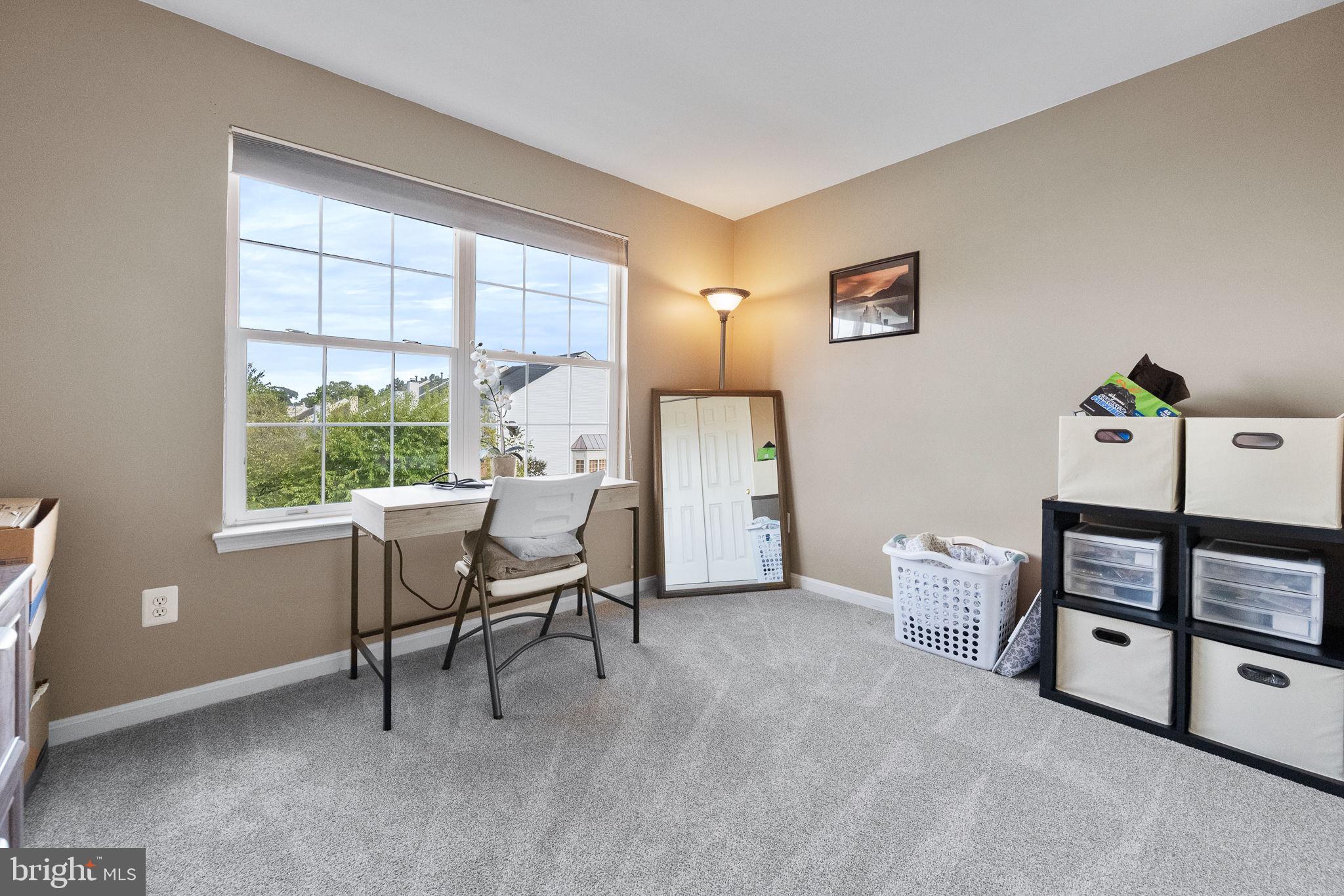 43111 Gatwick Square Ashburn, VA 20147 - Photo 21 of 34 a view of a livingroom with furniture and a window