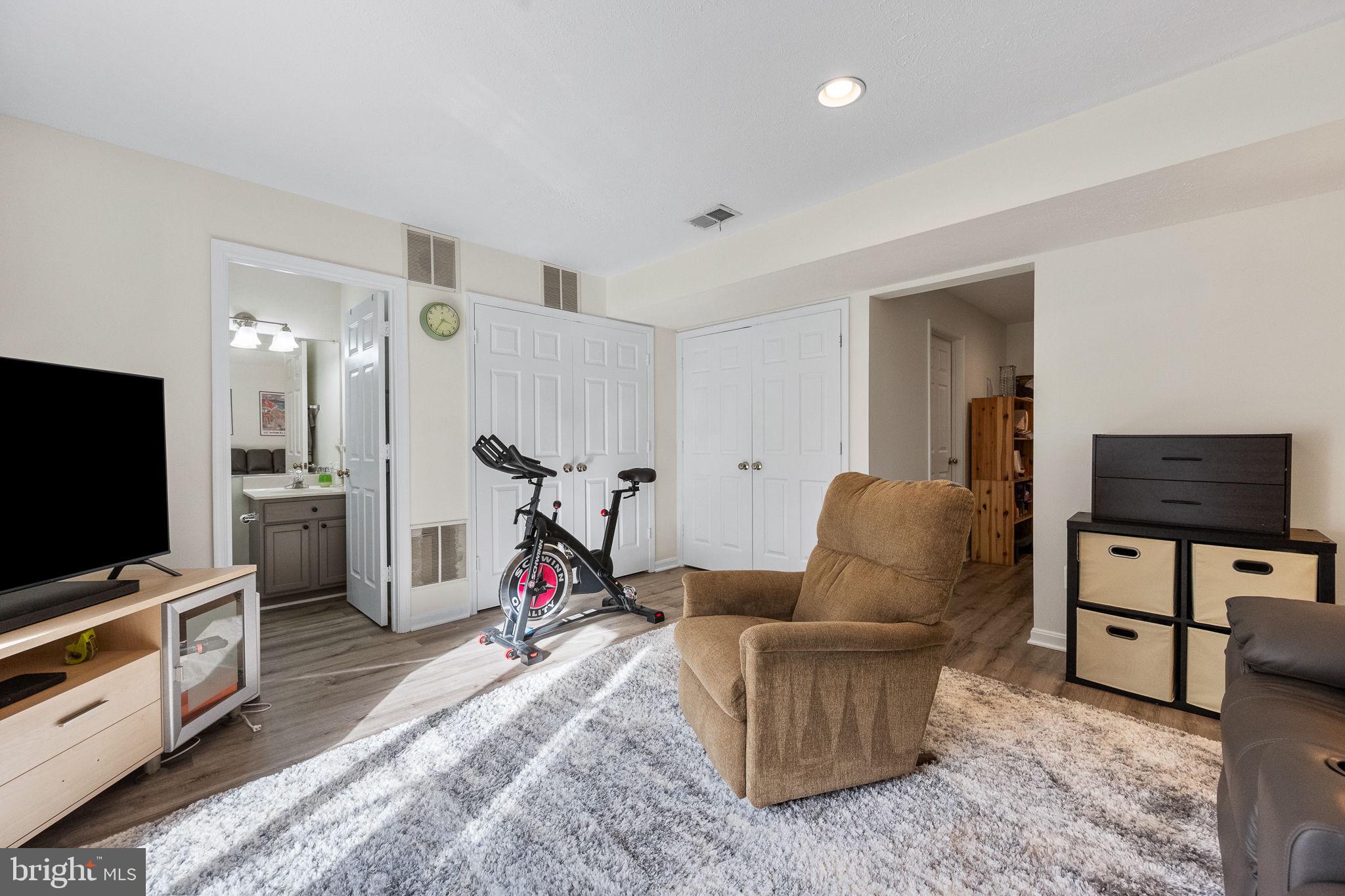 43111 Gatwick Square Ashburn, VA 20147 - Photo 25 of 34 a living room with furniture and a flat screen tv