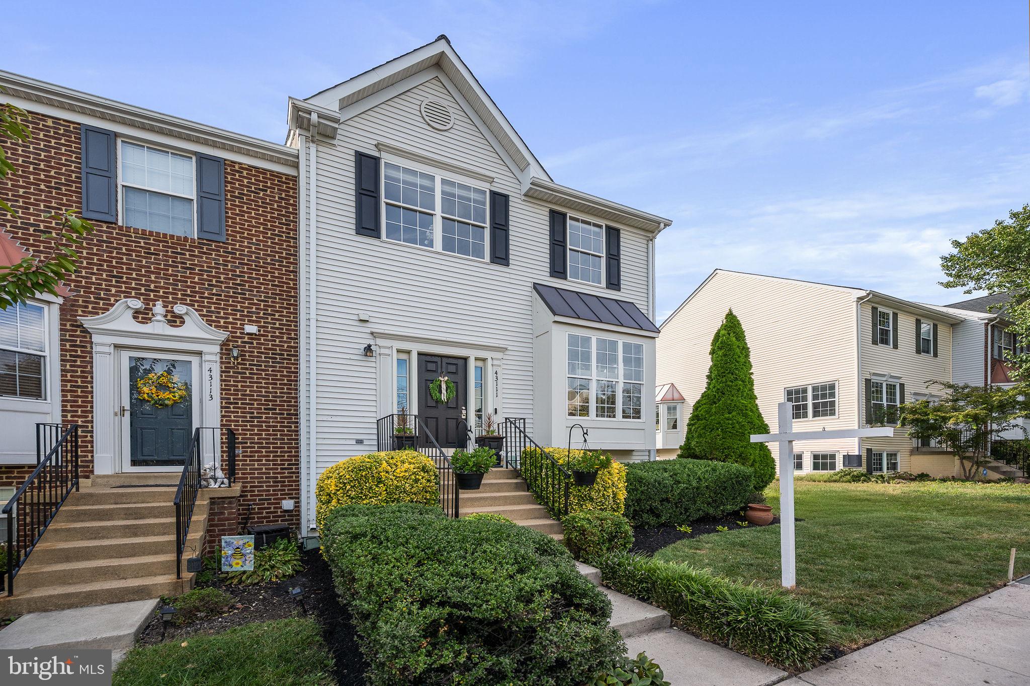 43111 Gatwick Square Ashburn, VA 20147 - Photo 3 of 34 a front view of a house with a yard