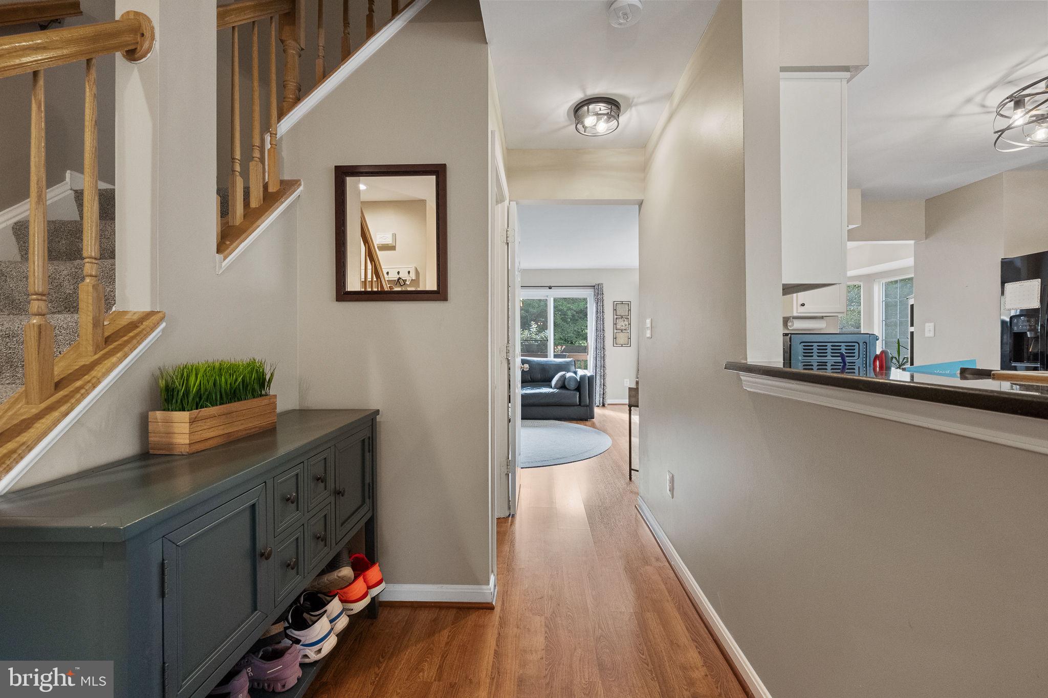 43111 Gatwick Square Ashburn, VA 20147 - Photo 6 of 34 a hallway with wooden floor