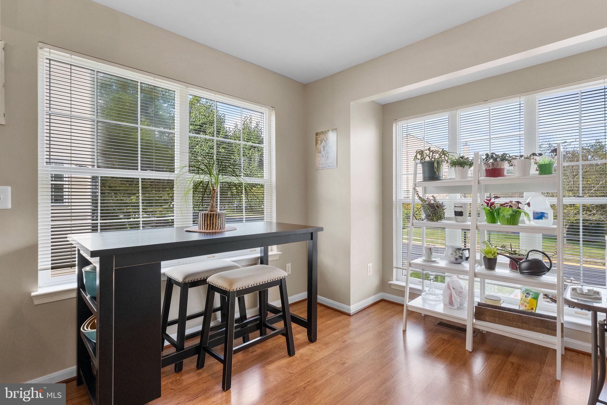 43111 Gatwick Square Ashburn, VA 20147 - Photo 9 of 34 a dining room with furniture and wooden floor