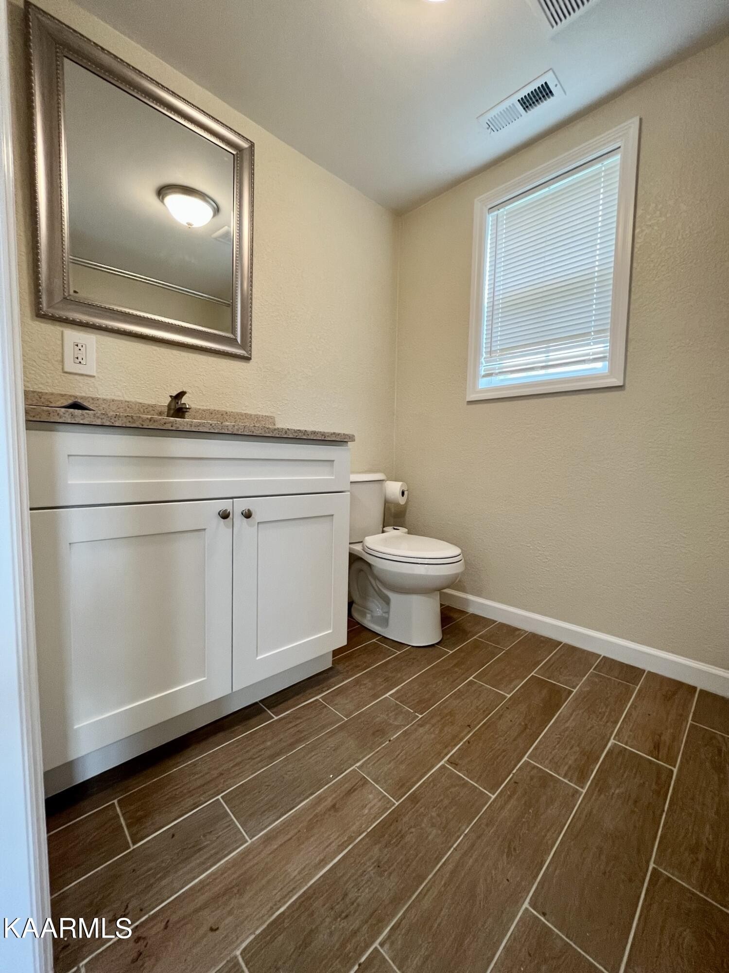 980 Sweetwater Road Philadelphia, TN 37846 - Photo 11 of 20 a bathroom with a toilet sink and mirror