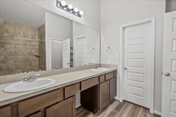 a bathroom with a bathtub and a shower