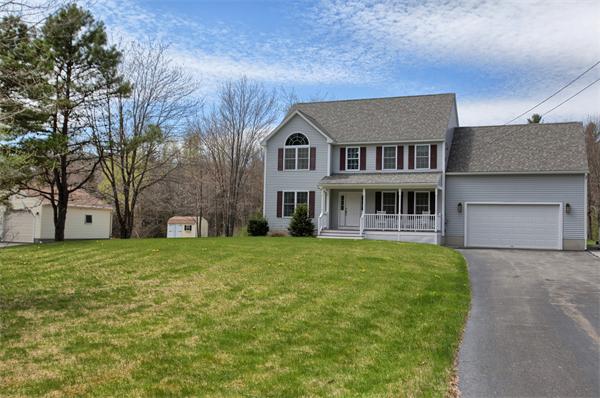 92 Scobie Pond Road Derry, NH 03038 - Photo 3 of 30 a front view of a house with a garden