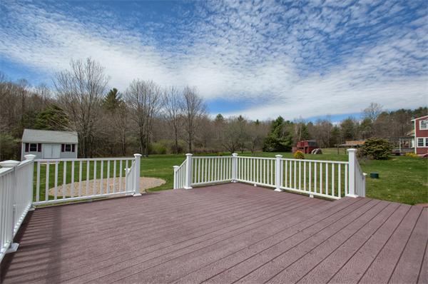 92 Scobie Pond Road Derry, NH 03038 - Photo 7 of 30 a view of a deck with a yard