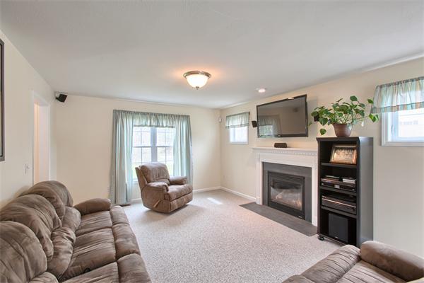92 Scobie Pond Road Derry, NH 03038 - Photo 10 of 30 a living room with furniture a window and a flat screen tv