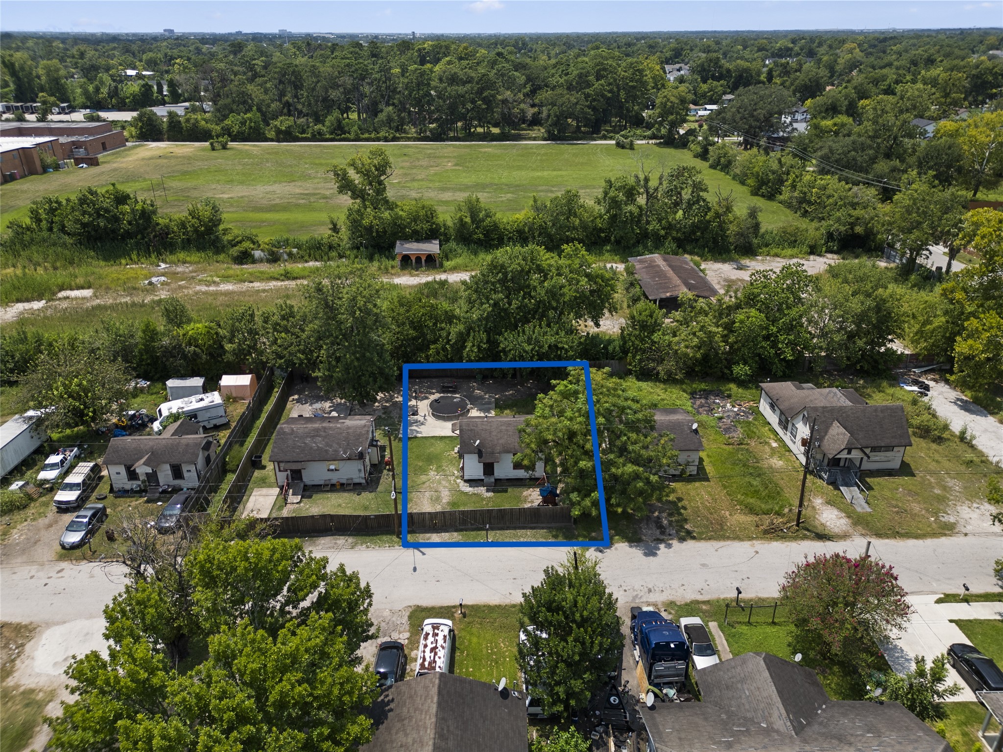 an aerial view of a house with outdoor space