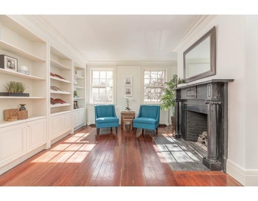 5 Charles River Square Boston, MA 02114 - Photo 11 of 21 a living room with furniture and a fireplace