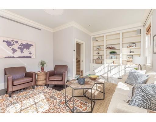 5 Charles River Square Boston, MA 02114 - Photo 13 of 21 a living room with furniture and a large window