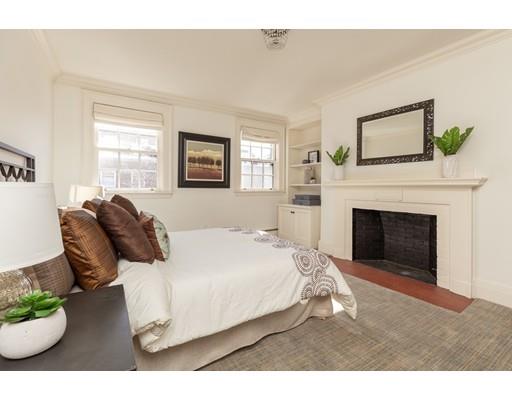 5 Charles River Square Boston, MA 02114 - Photo 17 of 21 a living room with furniture and a fireplace