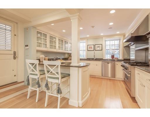 5 Charles River Square Boston, MA 02114 - Photo 4 of 21 a kitchen with stainless steel appliances kitchen island granite countertop a stove and cabinets