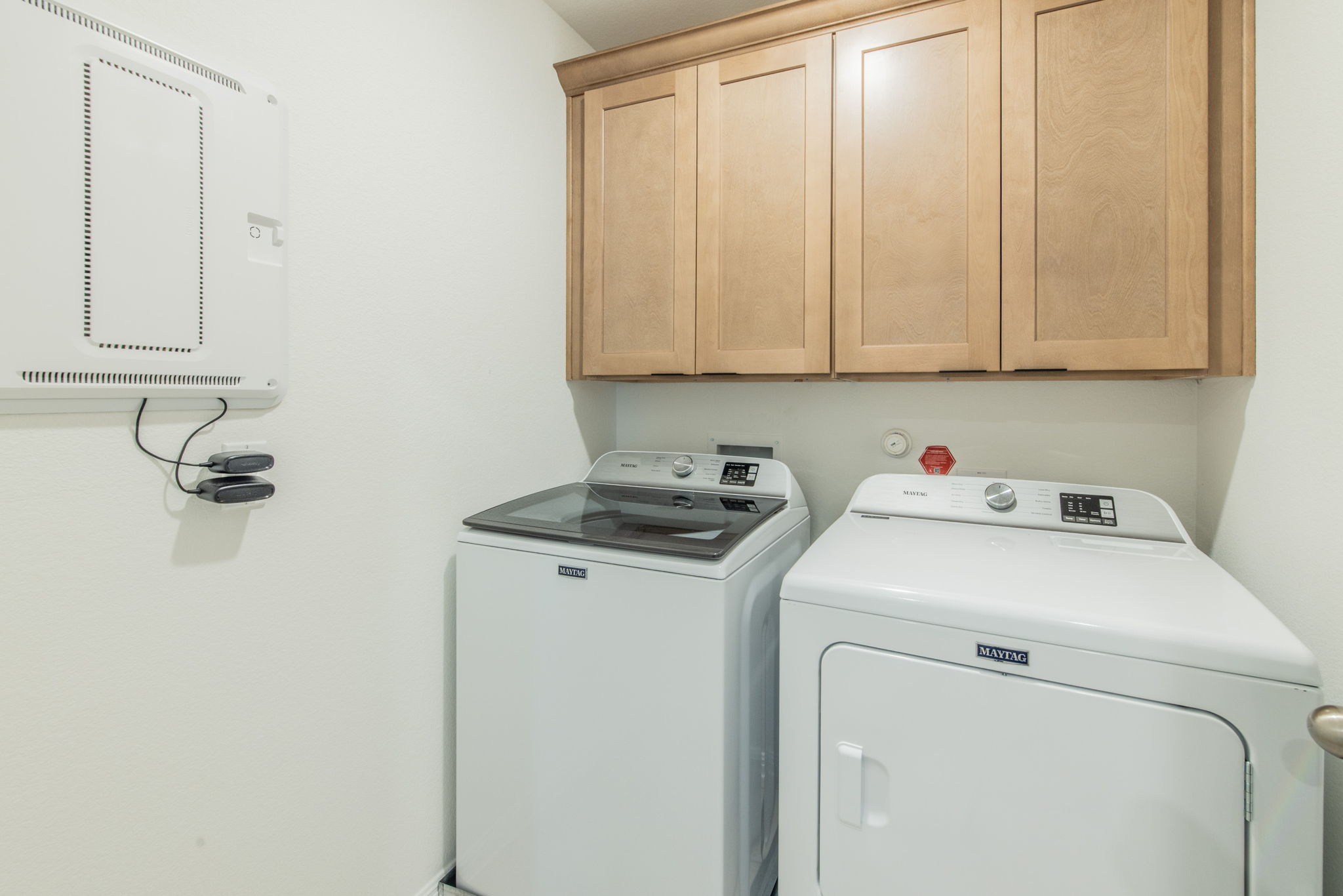 593 Backstays Loop Kyle, TX 78640 - Photo 19 of 26 a view of storage and utility room with washer and dryer